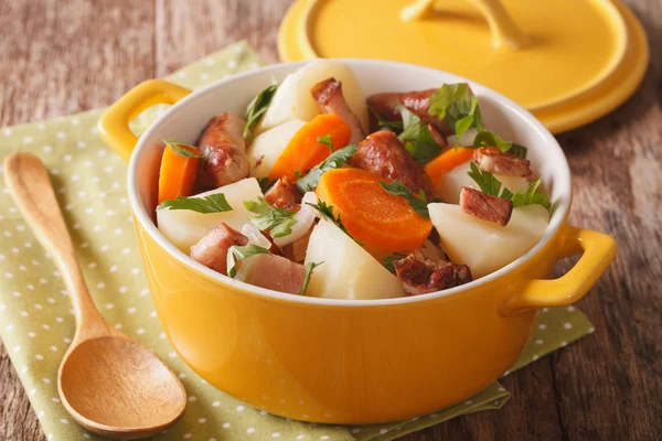 Traditional Irish dish is coddle with sausages, bacon and vegeta — Stock Photo, Image