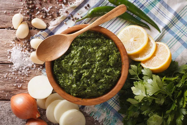 Argentine chimichurri sauce with ingredients close-up. horizonta — Stock Photo, Image