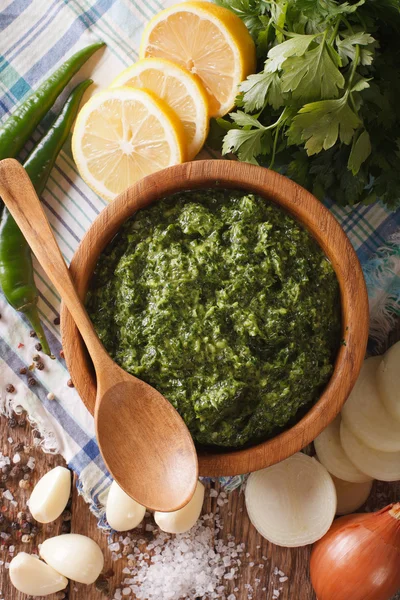 Chimichurri sauce with ingredients close-up. vertical top view — Stock Photo, Image