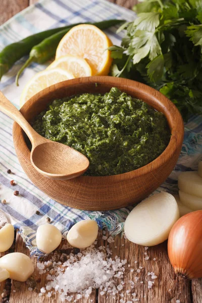 Argentine chimichurri sauce with ingredients close-up. vertical — Stock Photo, Image