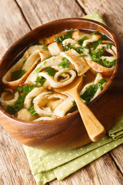 Frittatensuppe sliced pancake soup close-up in a plate on the table. vertica — Stock Image Frittatensuppe Sliced Pancake Soup Close Plate Table Vertica Stock Photo