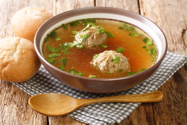 Beef broth or Rindsuppe is the most popular of Austrias with pancake strips Frittaten, semolina dumplings, liver dumpling close-up in a saucepan on the table. horizontal — Stock Image Beef Broth Rindsuppe Most Popular Austrias Pancake Strips Frittaten Semolina Stock Picture