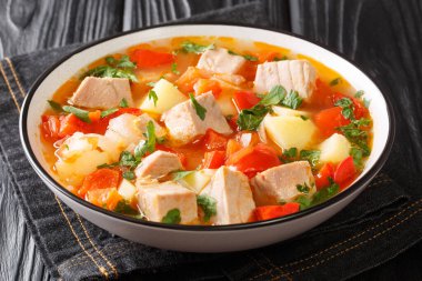 Bonito Marmitako Basque tuna stew with vegetables closeup in the plate on the table. Horizonta clipart