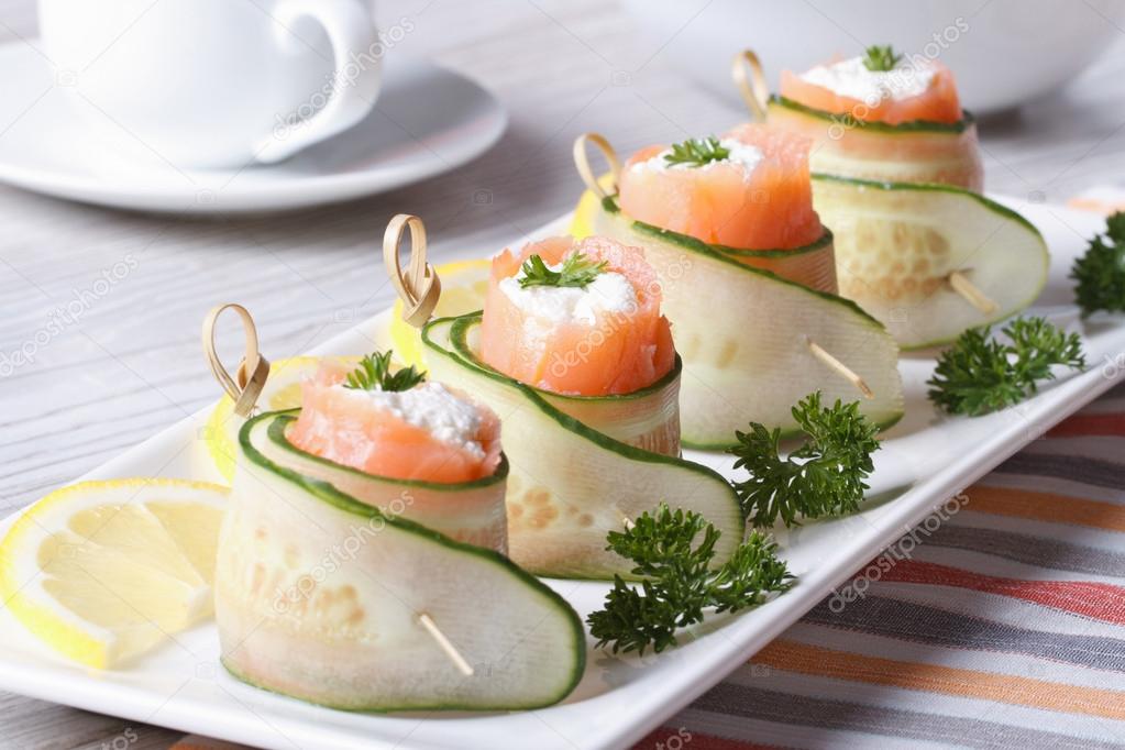 cucumber rolls with salmon, cream cheese closeup horizontal