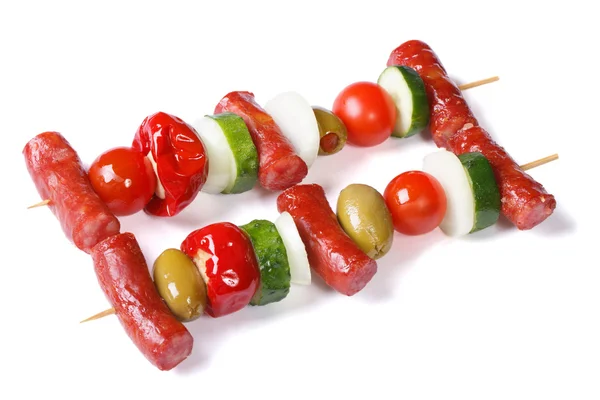 Grilled sausages with vegetables on skewers isolated — Stock Photo, Image