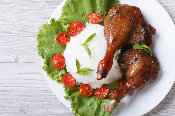 Roasted duck leg with rice closeup horizontal. top view — Stock Photo, Image