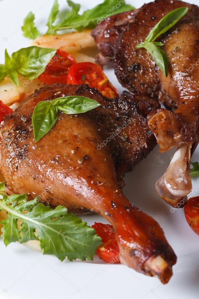roasted duck legs with tomato and arugula macro vertical 