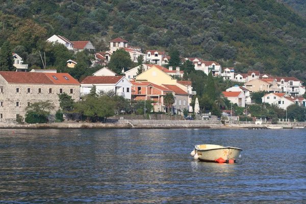 Small boat on the background of fishing village Stoliv — Stock Photo, Image