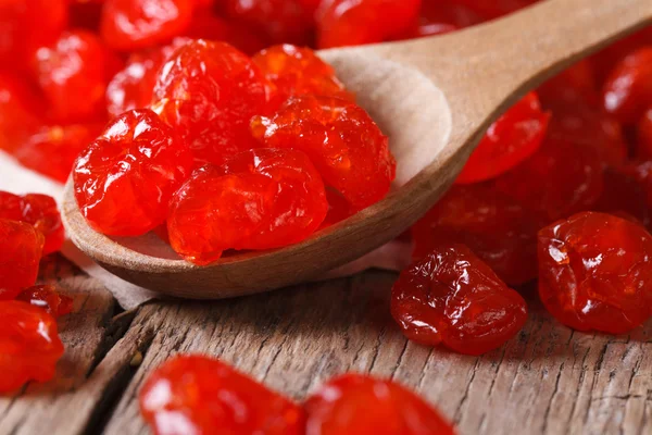 Dried red cherries in a wooden spoon,  horizontal — Stock Photo, Image