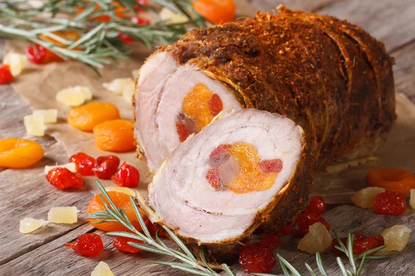 Pork meat with dried apricots, cherries and pineapple