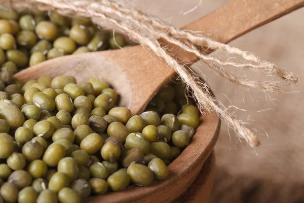 Green mung bean in a wooden bowl macro. Horizontal — Stock Photo, Image