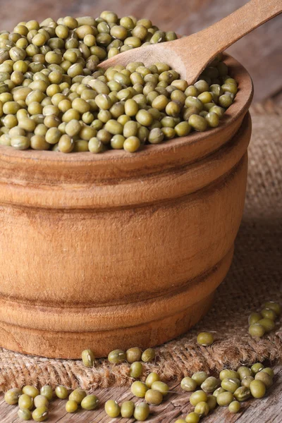 Mung beans in a wooden bowl on the table, vertical — Stock Photo, Image