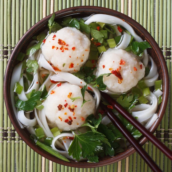 Traditional rice noodle soup with fish balls top view — Stock Photo, Image