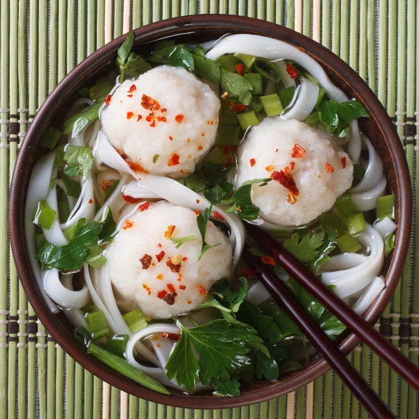 Traditional rice noodle soup with fish balls top view — Stock Image Traditional rice noodle soup with fish balls top view Royalty Free Stock Images