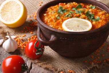 Red lentil soup with vegetables close-up on the table. horizonta clipart