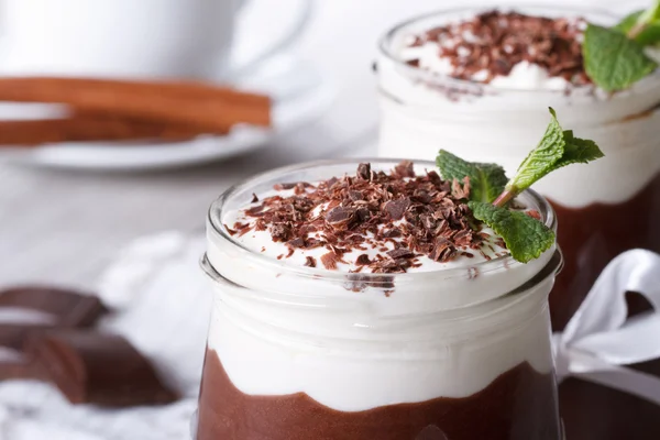 Chocolate mousse with whipped cream in a jar. macro — Stock Photo, Image