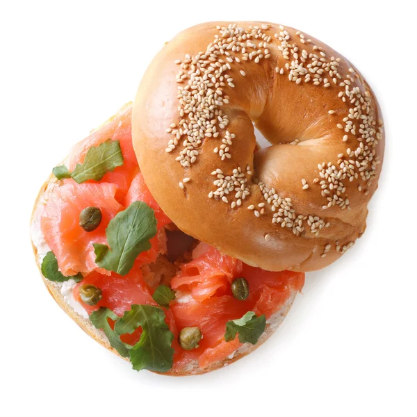 Bagel with red fish and soft cheese isolated top view — Stock Photo, Image