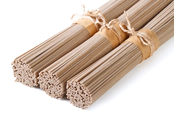 Buckwheat soba noodles in bunches isolated on white — Stock Photo, Image