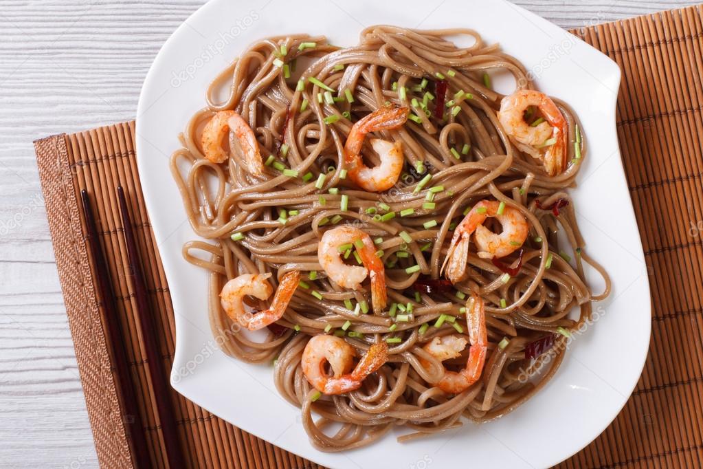 buckwheat soba noodles with shrimp close-up. horizontal top view