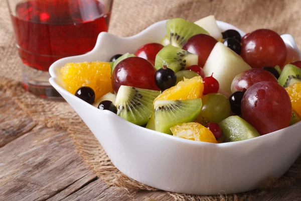 Fruit salad and grape juice close up. horizontal — Stock Photo, Image