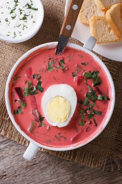 Delicious red beet soup with egg and sour cream top view — Stock Image Delicious red beet soup with egg and sour cream top view Stock Photo