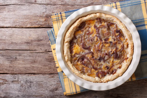 French onion pie on the table. horizontal view from above