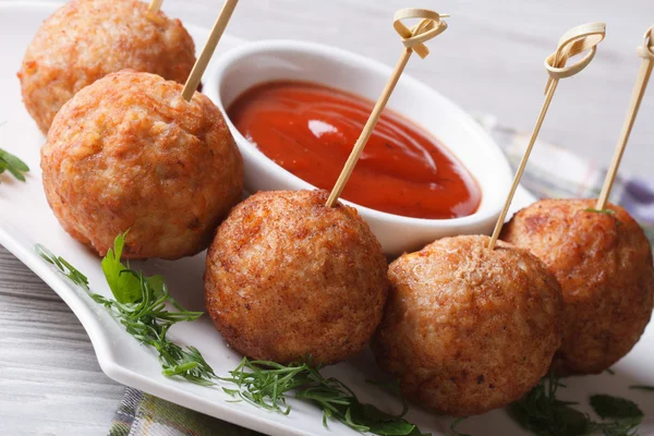 Fried meatballs on skewers and tomato sauce, horizontal — Stock Photo, Image