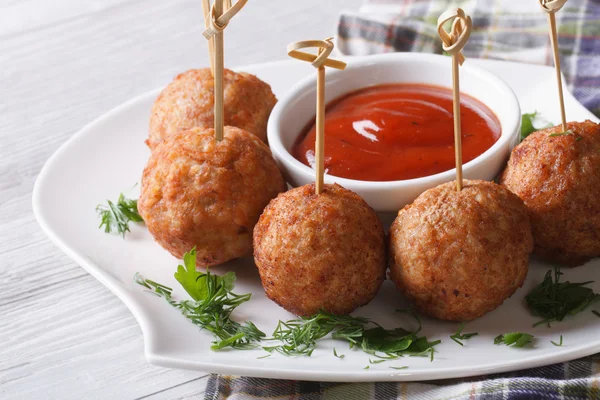 Meatballs on skewers and ketchup on a plate, horizontal — Stock Photo, Image