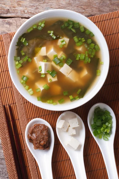 Japanese miso soup and ingredients. top view vertical — Stock Image Japanese miso soup and ingredients. top view vertical Royalty Free Stock Photos
