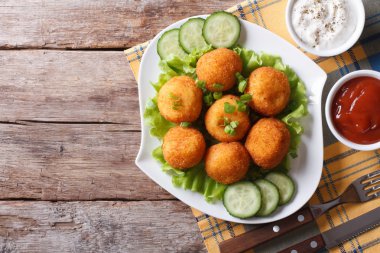 potato croquette with sauce on a plate top view horizontal clipart