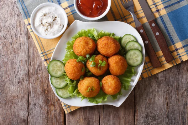 Potato croquettes with sour cream and ketchup top view — Stock Photo, Image