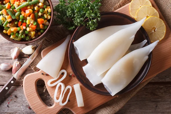 Preparation of raw squid and ingredients horizontal top view — Stock Photo, Image
