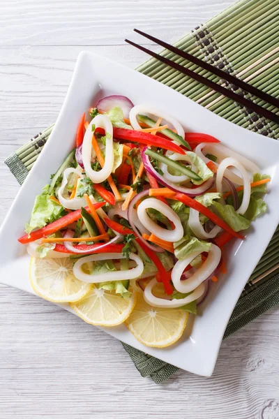 Asian Salad of squid with vegetables vertical top view — Stock Photo, Image