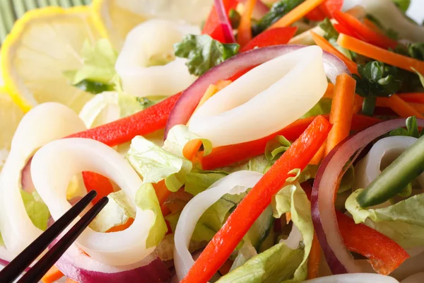 Japanese salad with vegetables and squid macro. horizontal — Stock Photo, Image