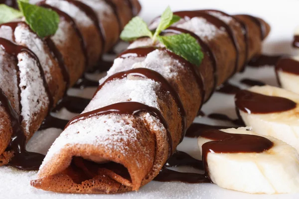 Chocolate Pancakes with sauce and banana macro. Horizontal — Stock Photo, Image