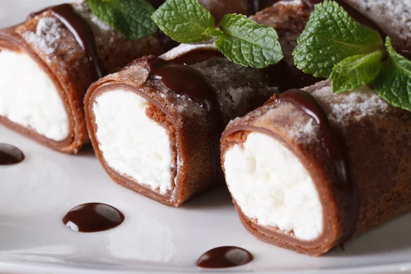 Delicious chocolate crepes with soft cheese and mint closeup — Stock Photo, Image