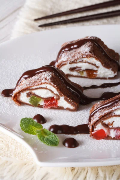 Japanese chocolate crepe roll with cheese close-up. Vertical — Stock Photo, Image