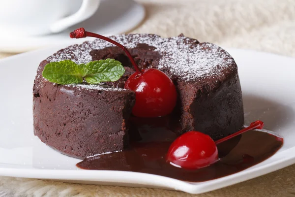 Chocolate fondant with cherries macro and and coffee. horizontal — Stock Photo, Image
