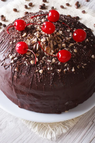 Chocolate cake with cherries and nuts. Vertical closeup — Stock Photo, Image
