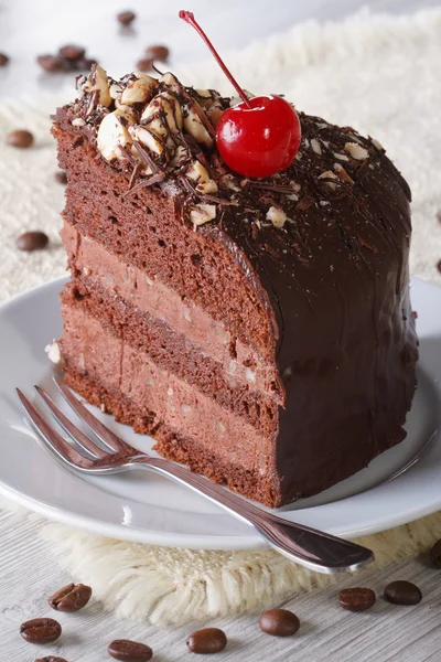 Delicious piece of dark chocolate cake with cherry — Stock Photo, Image