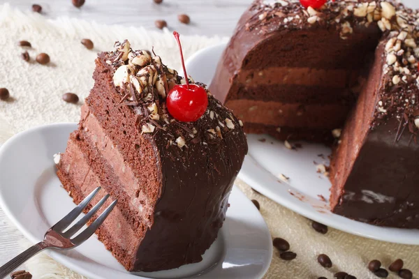 Cut a piece of dark chocolate cake with cherry horizontal — Stock Photo, Image