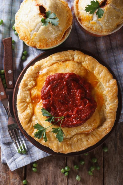 Delicious meat pies on a table. vertical top view close-up — Stock Photo, Image