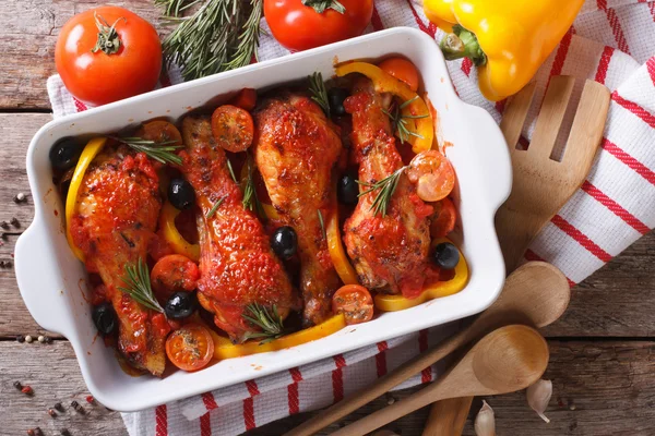 Chicken legs in tomato sauce with olives horizontal top view — Stock Photo, Image