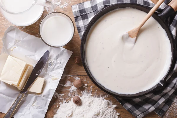 Preparation of bechamel sauce horizontal top view close-up — Stock Photo, Image