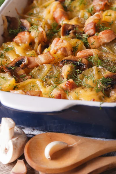 Potato with bacon and mushrooms in baking dish. vertical — Stock Photo, Image