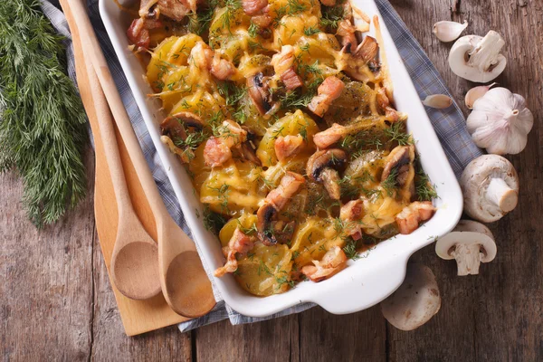 Casserole potato with bacon and mushrooms horizontal top view — Stock Image Casserole potato with bacon and mushrooms horizontal top view Stock Photo