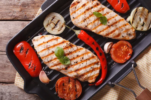 Chicken fillet with vegetables in pan horizontal top view — Stock Photo, Image