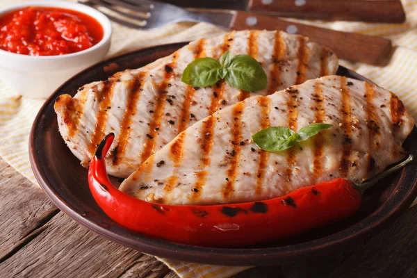 Grilled chicken fillet with chili peppers and sauce. Horizontal — Stock Photo, Image