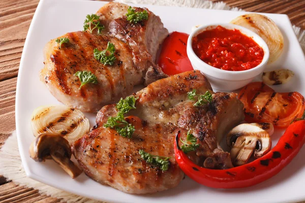 Roast pork with grilled vegetables on white plate horizontal — Stock Photo, Image