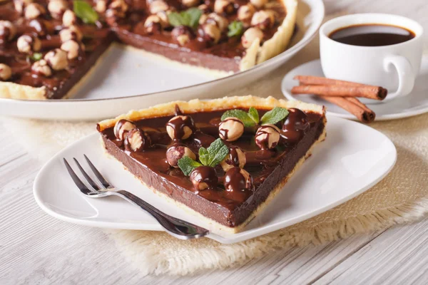 Chocolate tart with hazelnut and coffee close-up. Horizontal — Stock Photo, Image